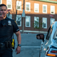 Officer helps at a traffic stop with a driver with an invalid license.